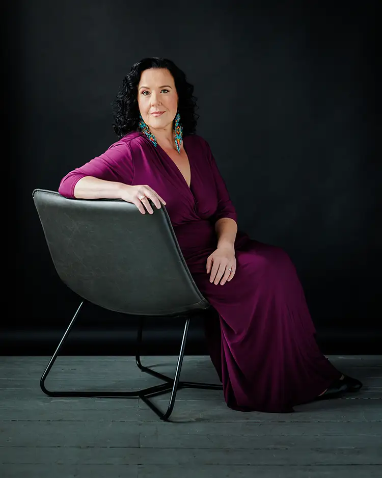 Kristine Dandavino sitting in a chair